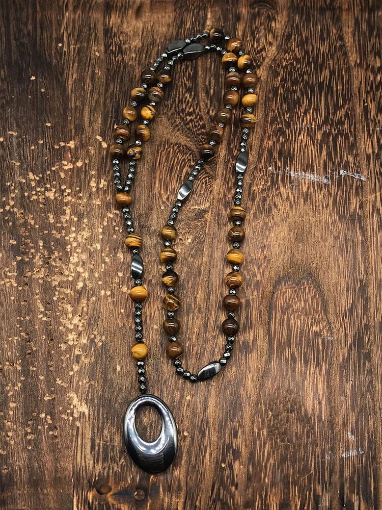 Collana con pendente a croce in pietra naturale